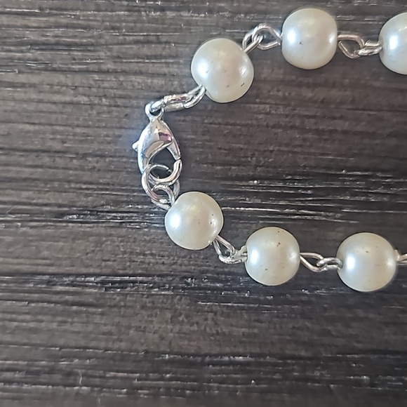 Cross Pendant Wrapped in a Metal Design on a Pearl Necklace - Picture 4 of 5